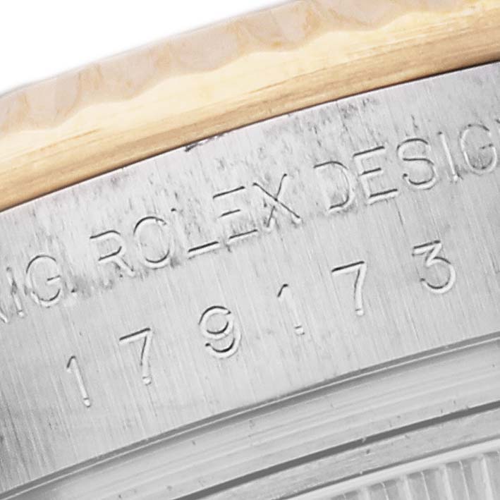 This image shows a close-up view of the engraved case back of a Rolex Datejust 179173 Women's Steel and Gold (two tone) Black Dial 179173 Women's Steel and Gold (two tone) Black Dial watch.