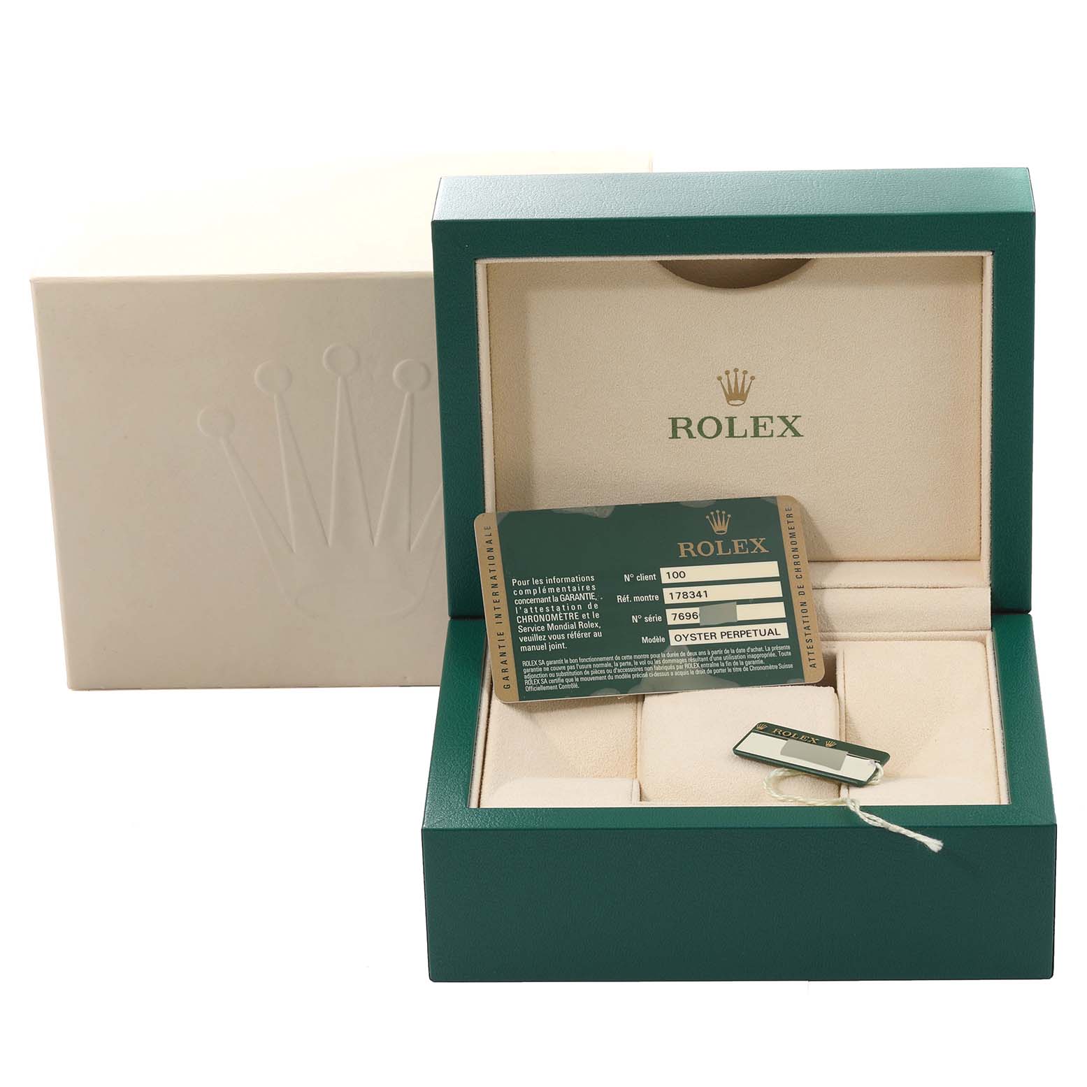 The image shows a Rolex box and authentication card for a Mid-Size model, with the card placed inside the box.