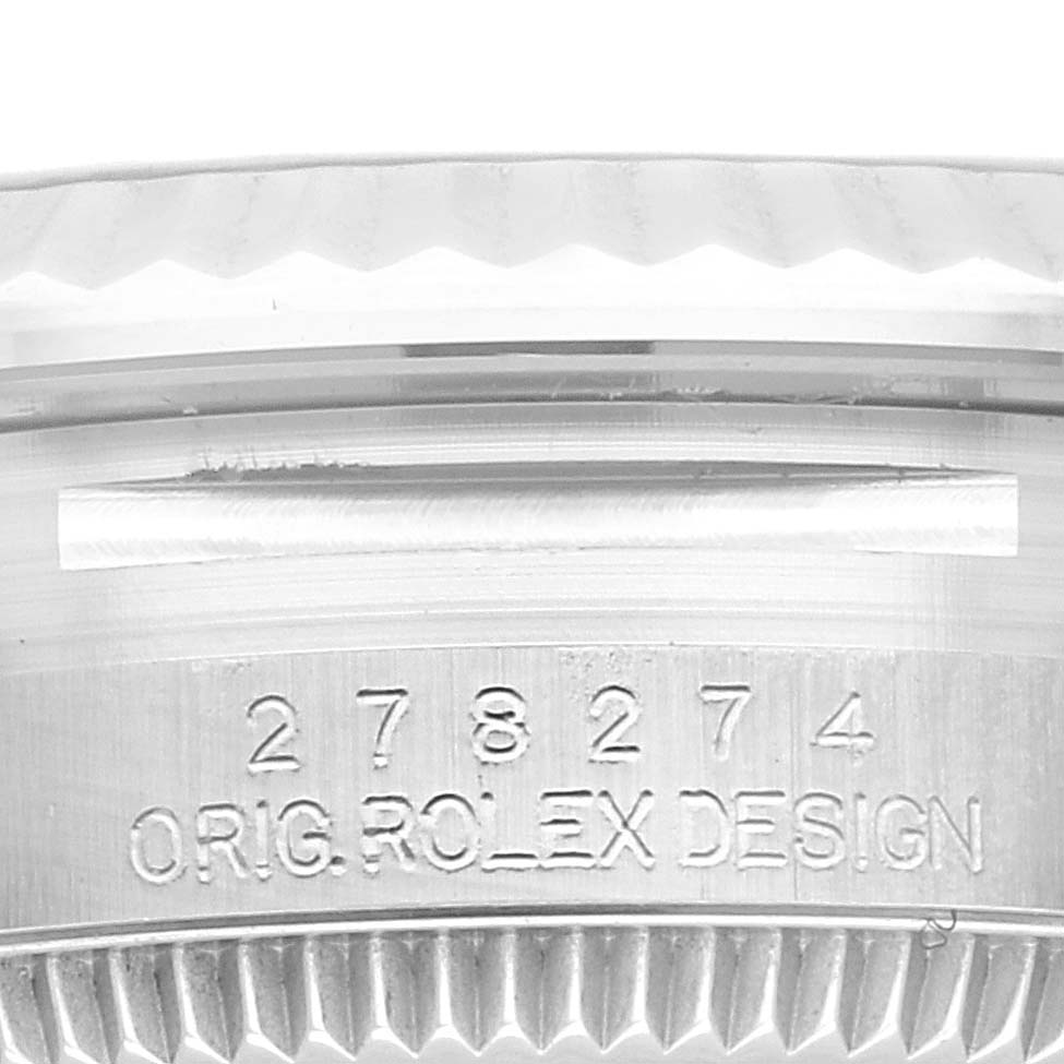 This close-up image shows the side of the mid-size Rolex watch case with engraved model number and design details.