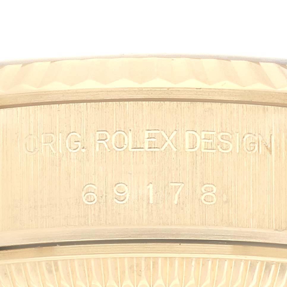 The image shows a close-up of the engraved case back edge of a Rolex President 69178 Women's Yellow Gold Silver Dial 69178 Women's Yellow Gold Silver Dial watch, highlighting its model number.