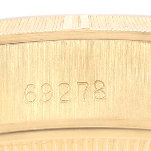 The image shows a close-up, angled view of the side case of a Rolex President 69278 Women
s Yellow Gold Champagne Dial 69278 Women
s Yellow Gold Champagne Dial model, displaying the model number 69278.