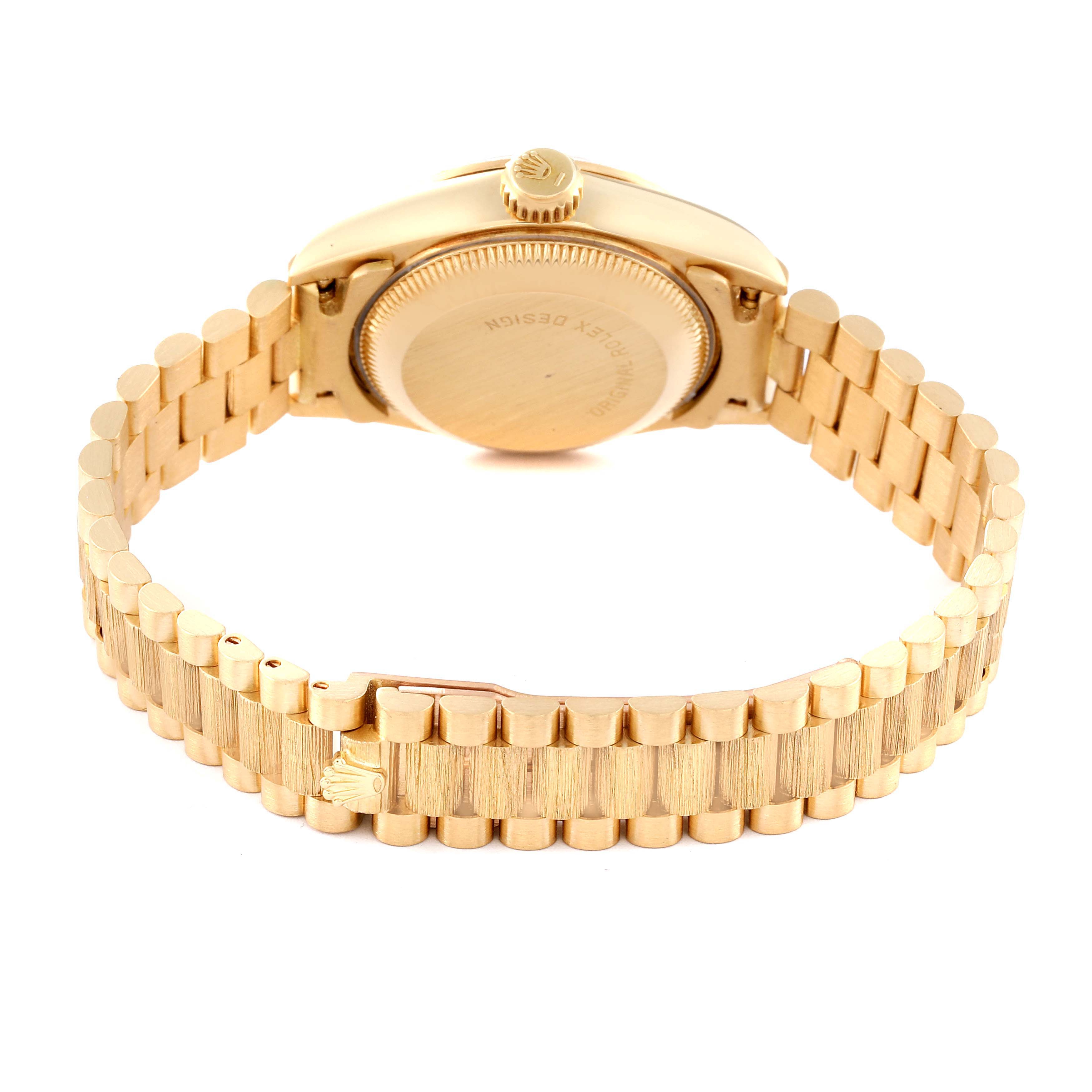 The image shows the back view of a Rolex President 69278 Women
s Yellow Gold Champagne Dial 69278 Women
s Yellow Gold Champagne Dial model watch, highlighting the clasp and case back.