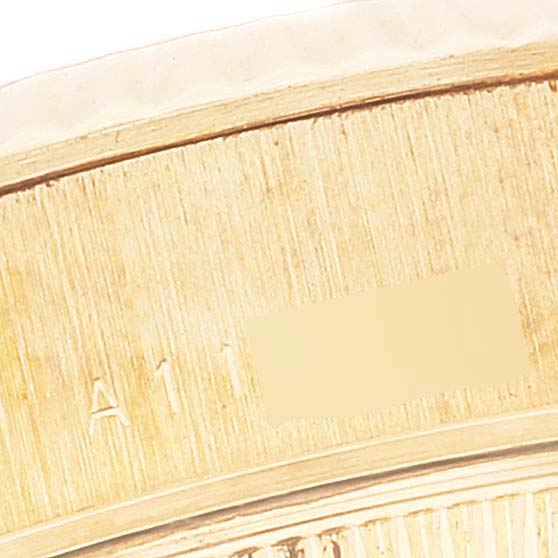 The image shows a close-up of the edge of the bezel and case side of a Rolex President 79178 Women
s Yellow Gold Champagne Dial 79178 Women
s Yellow Gold Champagne Dial model watch.