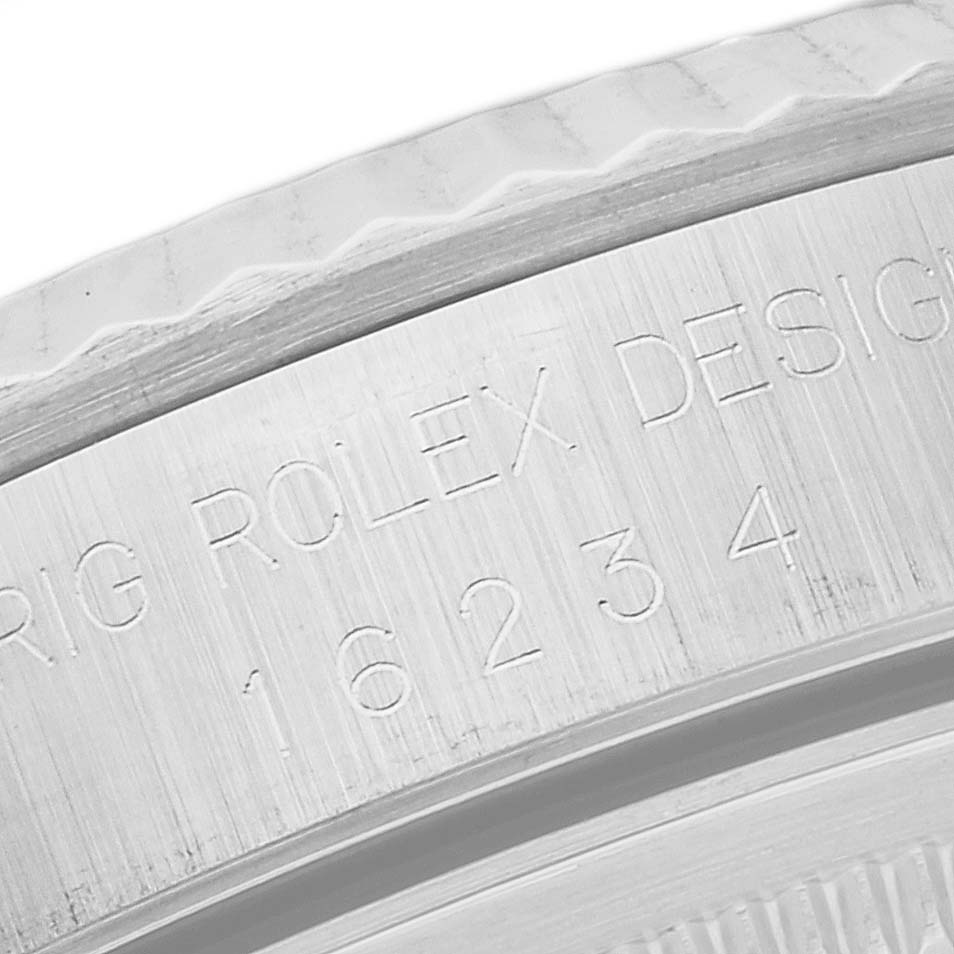 The image shows a close-up angle of the engraved case back of a Rolex Datejust 16234 Men's Stainless Steel Silver Dial 16234 Men's Stainless Steel Silver Dial model, displaying the model number and branding.
