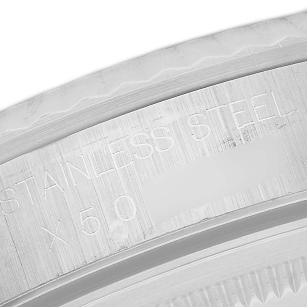 This image shows a close-up of the stainless steel case engraving on a Rolex Datejust 16234 Men's Stainless Steel Silver Dial 16234 Men's Stainless Steel Silver Dial watch.