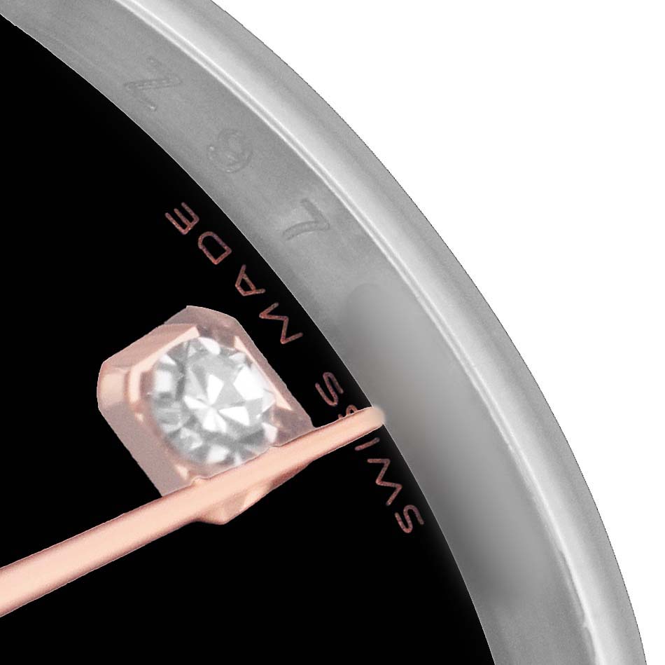The image shows a close-up view of the hour marker and part of the bezel of a Rolex Datejust 179161 Women's Steel and Gold (two tone) Black Dial watch.