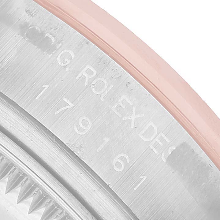 The image shows a close-up view of the Rolex Datejust 179161 Women's Steel and Gold (two tone) Black Dial model's case side with engraved markings.