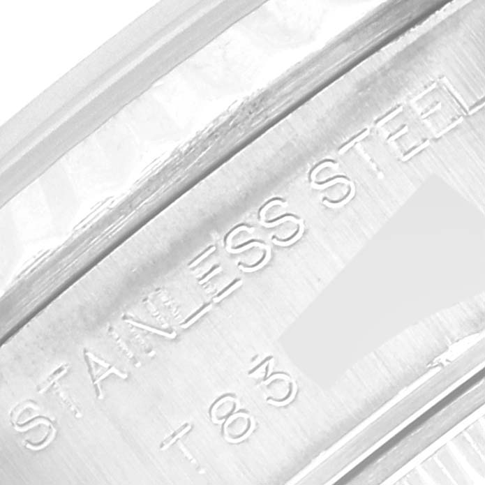 This is a close-up of the engraved text on the inner bezel of a Rolex Datejust 69174 Women's Stainless Steel Silver Dial 69174 Women's Stainless Steel Silver Dial, showing the words "STAINLESS STEEL."