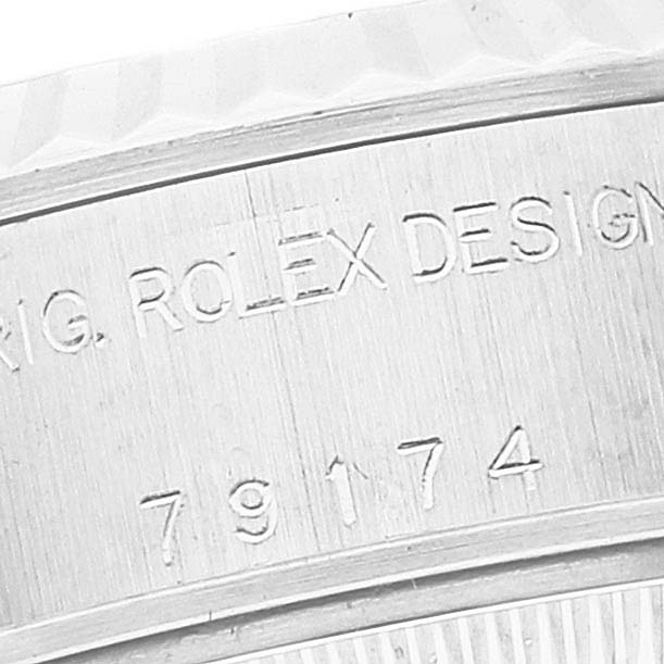 The image shows an angled close-up of the case with engravings of the Rolex Datejust 79174 Women's Stainless Steel Mother of Pearl Dial 79174 Women's Stainless Steel Mother of Pearl Dial watch model.