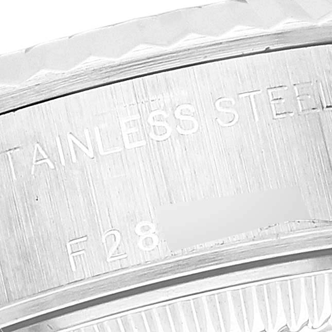 This close-up image of a Rolex Datejust 79174 Women's Stainless Steel Mother of Pearl Dial 79174 Women's Stainless Steel Mother of Pearl Dial watch shows the side engraving on the stainless steel case.