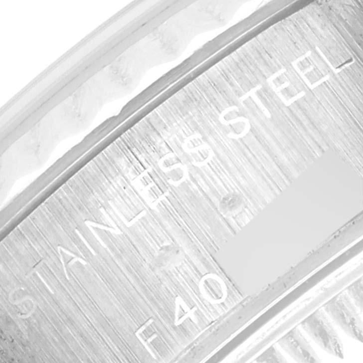 The image shows a close-up of the stainless steel casing and engravings on the Rolex Datejust 79174 Women's Stainless Steel Mother of Pearl Dial 79174 Women's Stainless Steel Mother of Pearl Dial model.