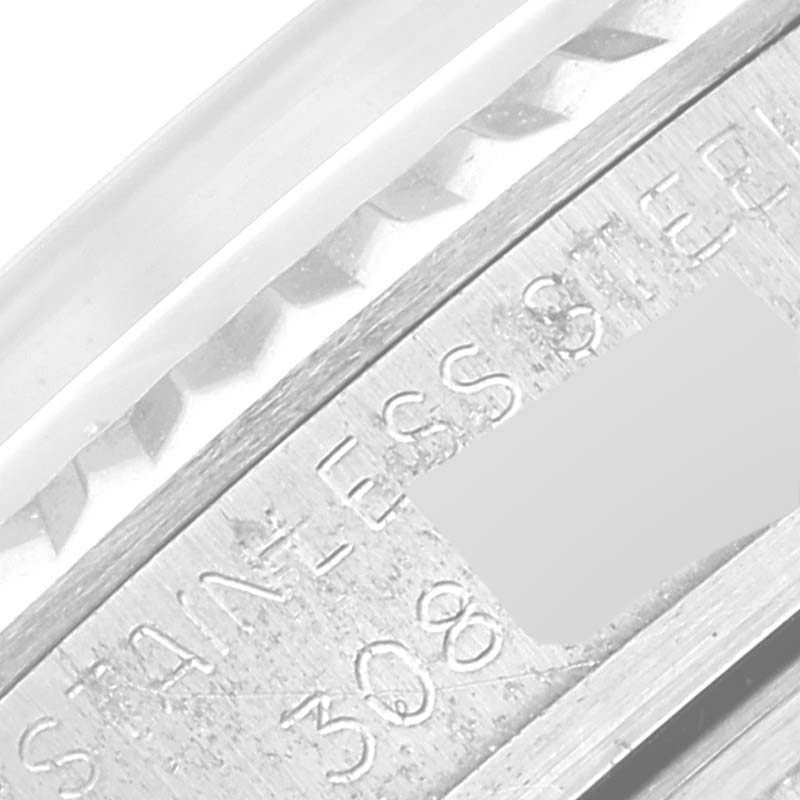 This close-up image shows the engraved serial number and "STAINLESS STEEL" text on a Rolex Vintage Collection 1601 Men's Stainless Steel Silver Dial 1601 Men's Stainless Steel Silver Dial watch.