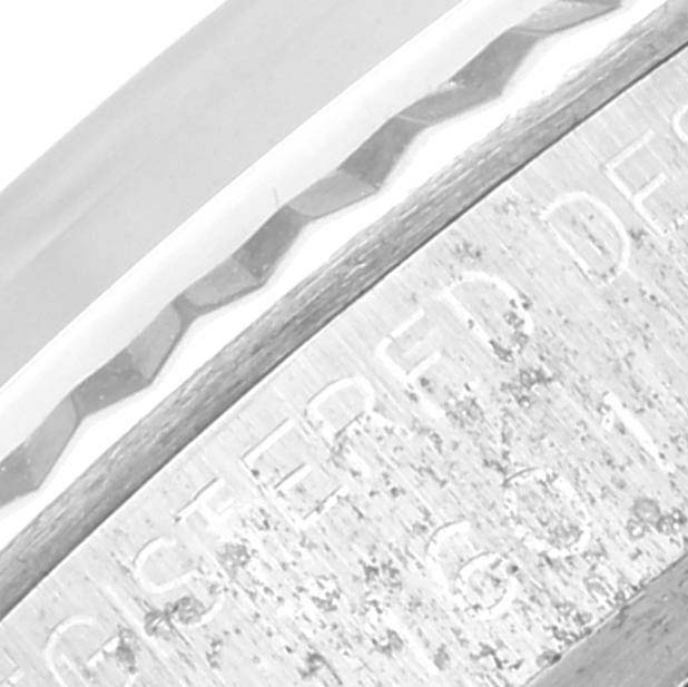 The close-up image shows the engraved edge and part of the bezel of the Vintage Collection model by Rolex.
