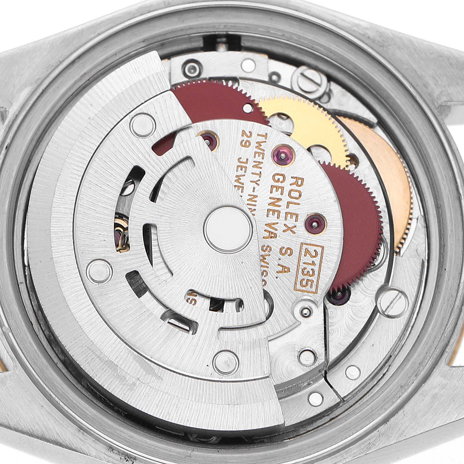 The image shows the Rolex Datejust 69173 Women's Steel and Gold (two tone) Champagne Dial watch movement from a top-down angle, highlighting its intricate gears and inner mechanism.