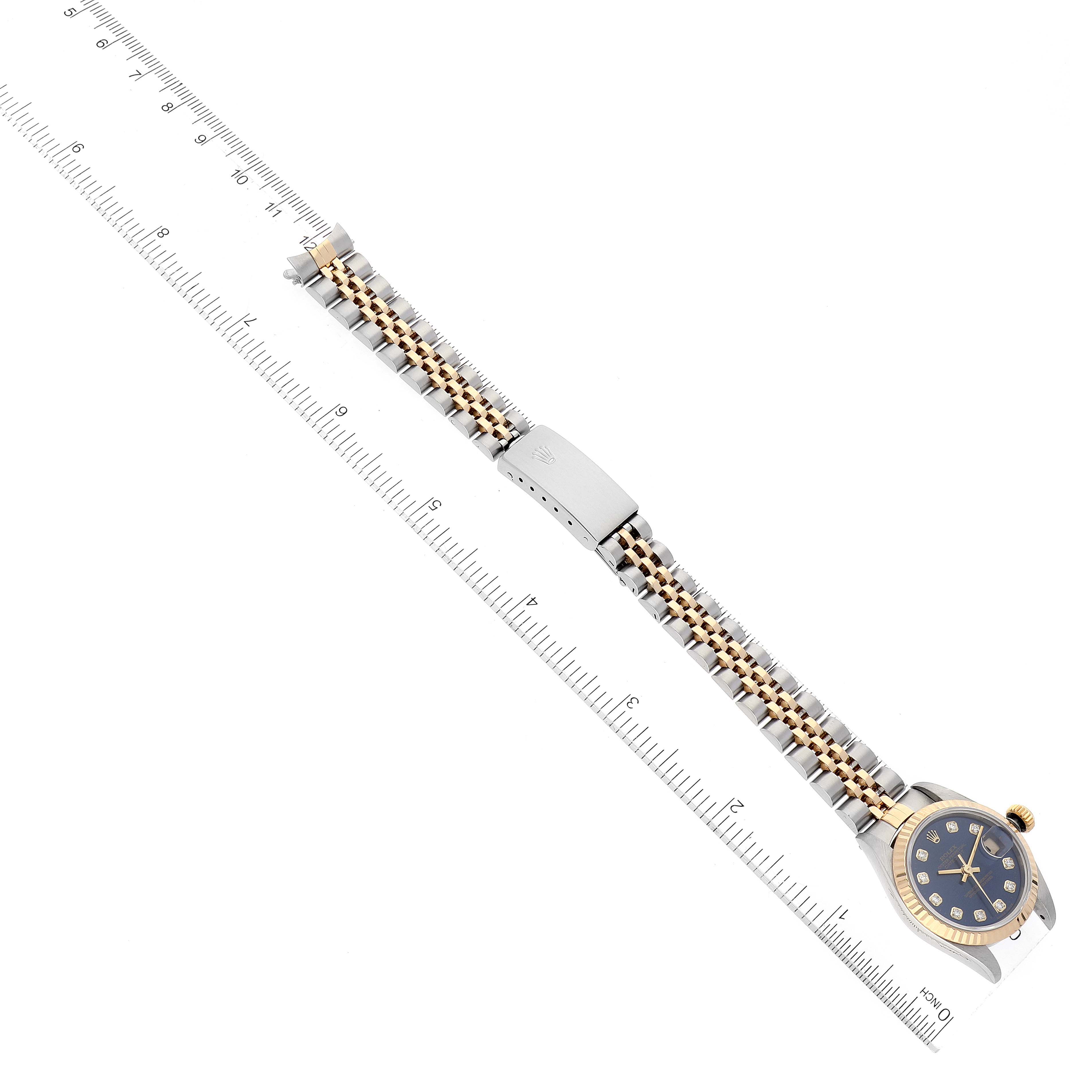This image shows a Rolex Datejust 69173 Women's Steel and Gold (two tone) Blue Dial 69173 Women's Steel and Gold (two tone) Blue Dial watch laid flat, displaying the bracelet, clasp, and face, aligned with a measuring ruler.