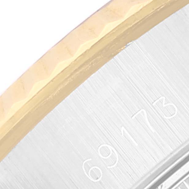 The image shows a close-up of the bezel and part of the casing of a Rolex Datejust 69173 Women's Steel and Gold (two tone) Champagne Dial 69173 Women's Steel and Gold (two tone) Champagne Dial watch, including the model number 69173.