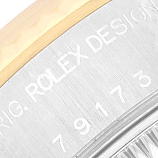 The image displays a close-up of the bezel and engraved text on a Rolex Datejust 79173 Women's Steel and Gold (two tone) Mother of Pearl Dial 79173 Women's Steel and Gold (two tone) Mother of Pearl Dial watch.