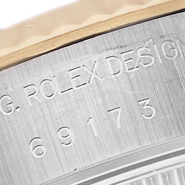 This close-up shows the engraved inner bezel and model number of a Rolex Datejust 69173G Women's Steel and Gold (two tone) White Dial 69173G Women's Steel and Gold (two tone) White Dial watch.