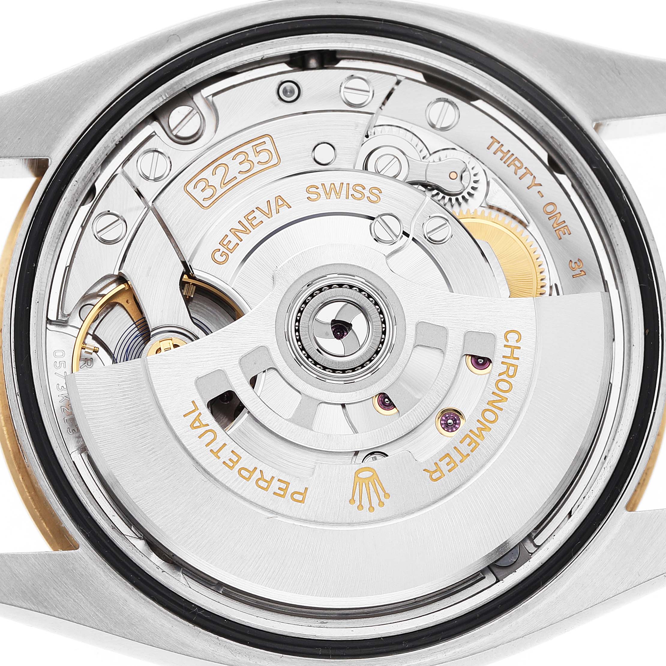 The image shows the movement of a Rolex Datejust 126233 Men's Steel and Gold (two tone) Champagne Dial, highlighting its intricate internal mechanics.