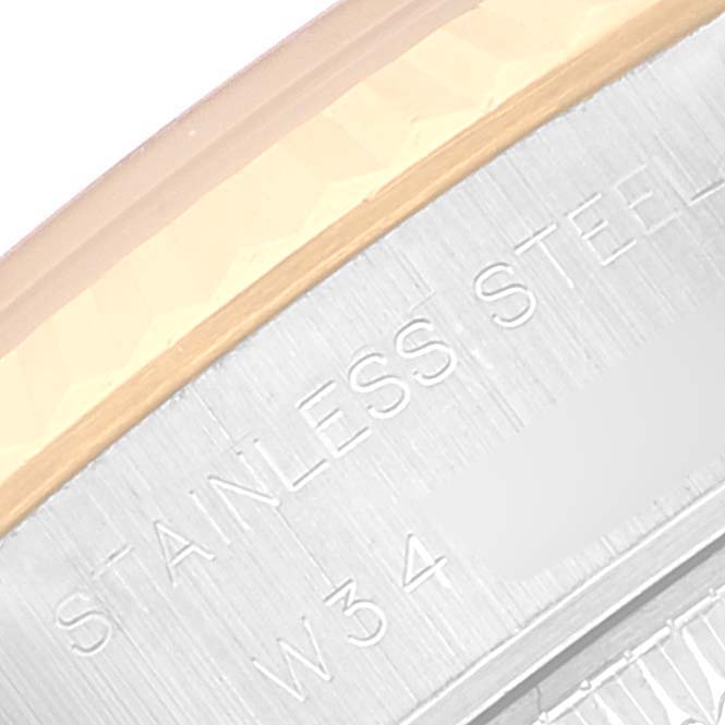 The image shows a close-up of the bezel and outer casing of a Rolex Datejust 69173 Women's Steel and Gold (two tone) White Dial 69173 Women's Steel and Gold (two tone) White Dial watch, highlighting its "Stainless Steel" engraving.