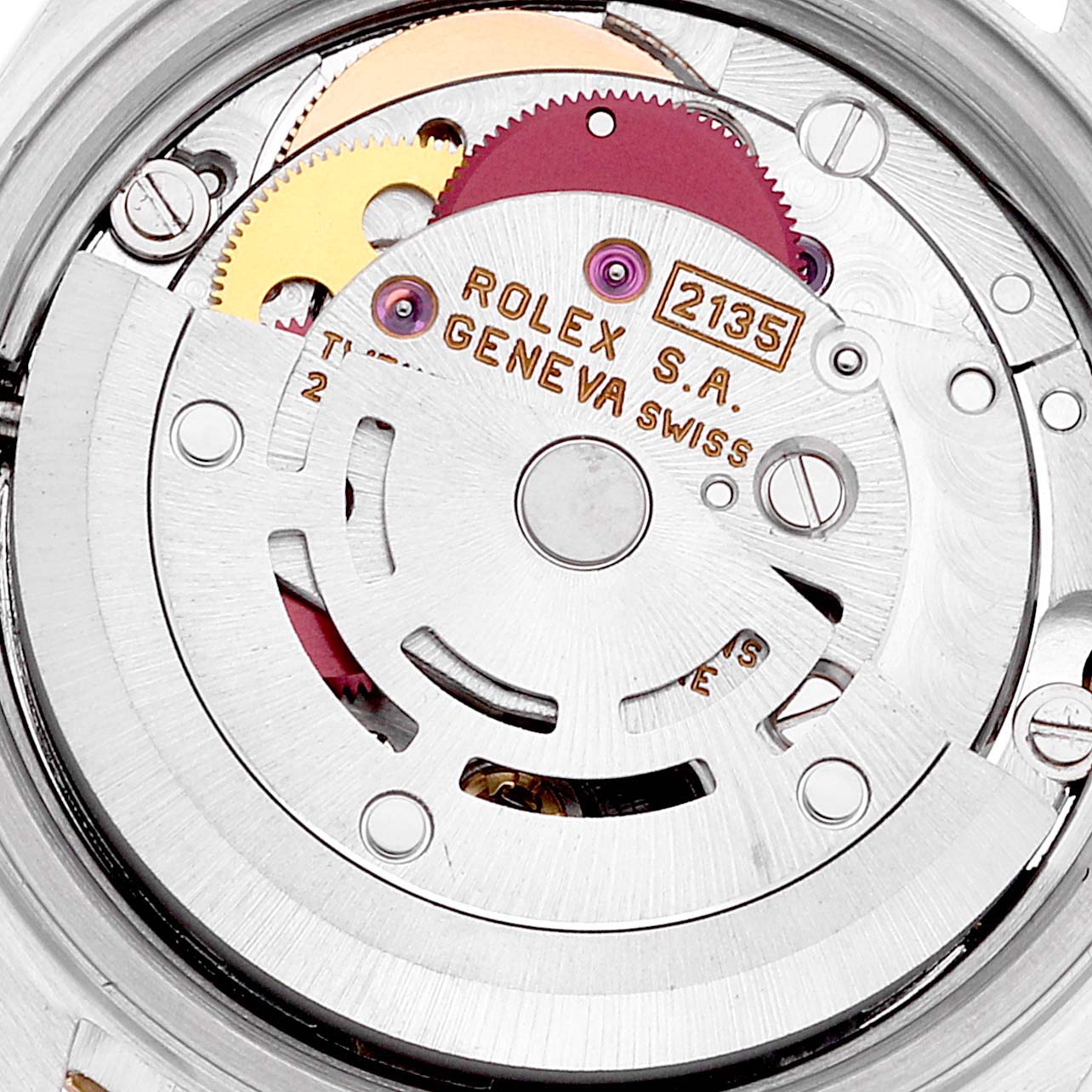 This is a close-up view of the movement mechanism inside the Rolex Datejust 69173 Women's Steel and Gold (two tone) White Dial 69173 Women's Steel and Gold (two tone) White Dial watch, showcasing gears and engravings.