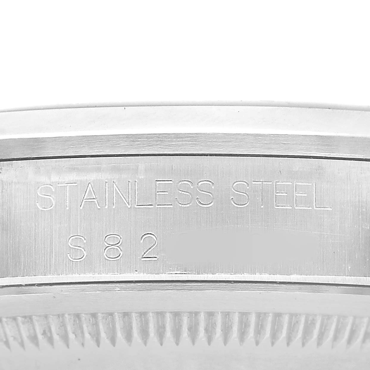 The image shows a close-up of the side of a Rolex Explorer 114270 Men's Stainless Steel Black Dial watch, highlighting the stainless steel material and engravings.