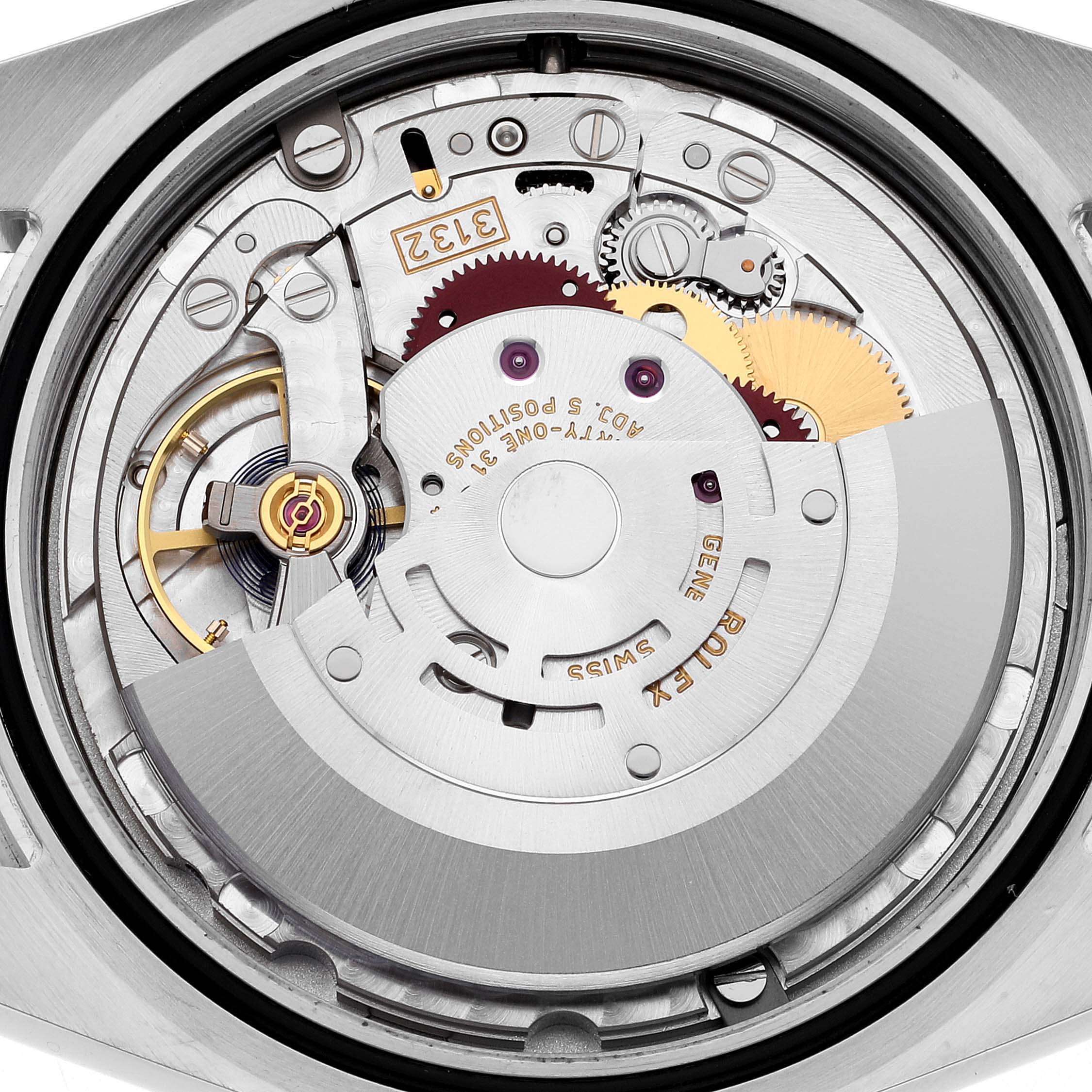 This image shows an angled view of the intricate internal movement of a Rolex Explorer 214270 Men's Stainless Steel Black Dial 214270 Men's Stainless Steel Black Dial watch, featuring gears and a rotor.