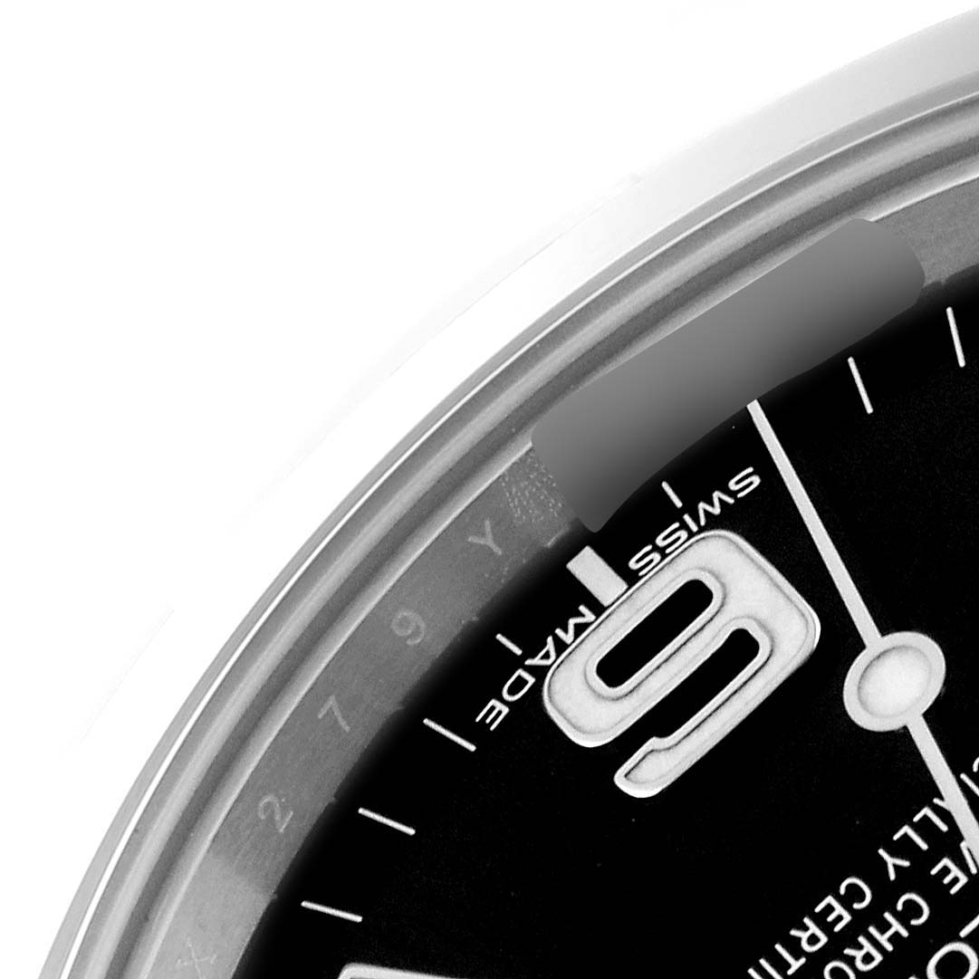 The image shows a close-up of the dial and bezel of a Rolex Explorer 214270 Men's Stainless Steel Black Dial 214270 Men's Stainless Steel Black Dial watch, highlighting the "9" marker and "Swiss Made" text.
