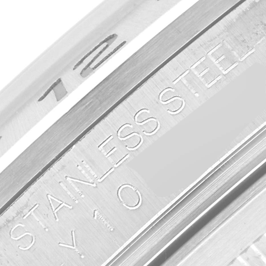 The image shows a close-up angle of the stainless steel engraving on the bezel of a Rolex Explorer 16570 Men's Stainless Steel White Dial 16570 Men's Stainless Steel White Dial watch.
