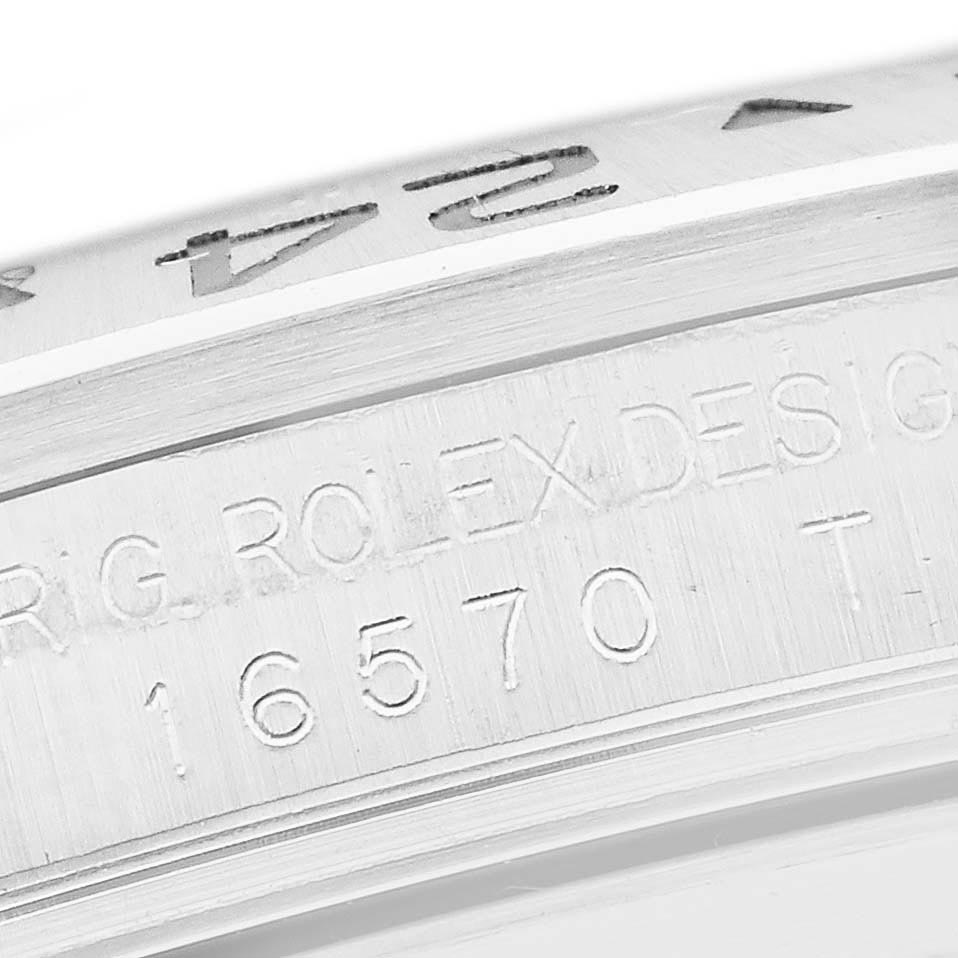 The image shows a close-up view of the Rolex Explorer 16570T Men's Stainless Steel Black Dial 16570T Men's Stainless Steel Black Dial model's engraved reference number on the inner bezel.