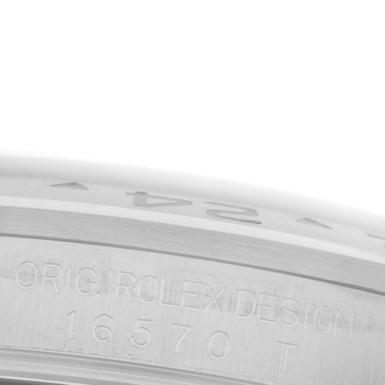 The image shows a close-up of the case side of a Rolex Explorer 16570T Men
s Stainless Steel Black Dial 16570T Men
s Stainless Steel Black Dial, focusing on the engraved design and model number "16570."