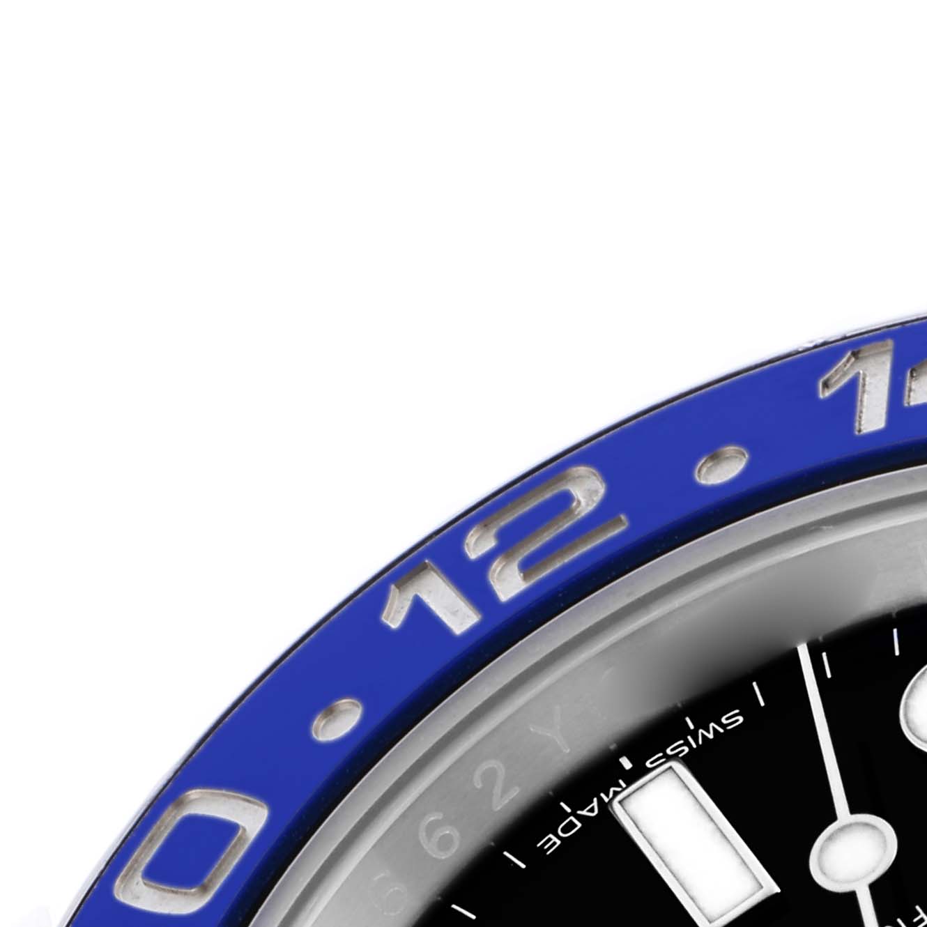 The image shows an angled close-up of the blue bezel and part of the dial of a Rolex GMT-Master 116710BLNR Men's Stainless Steel Black Dial 116710BLNR Men's Stainless Steel Black Dial watch.