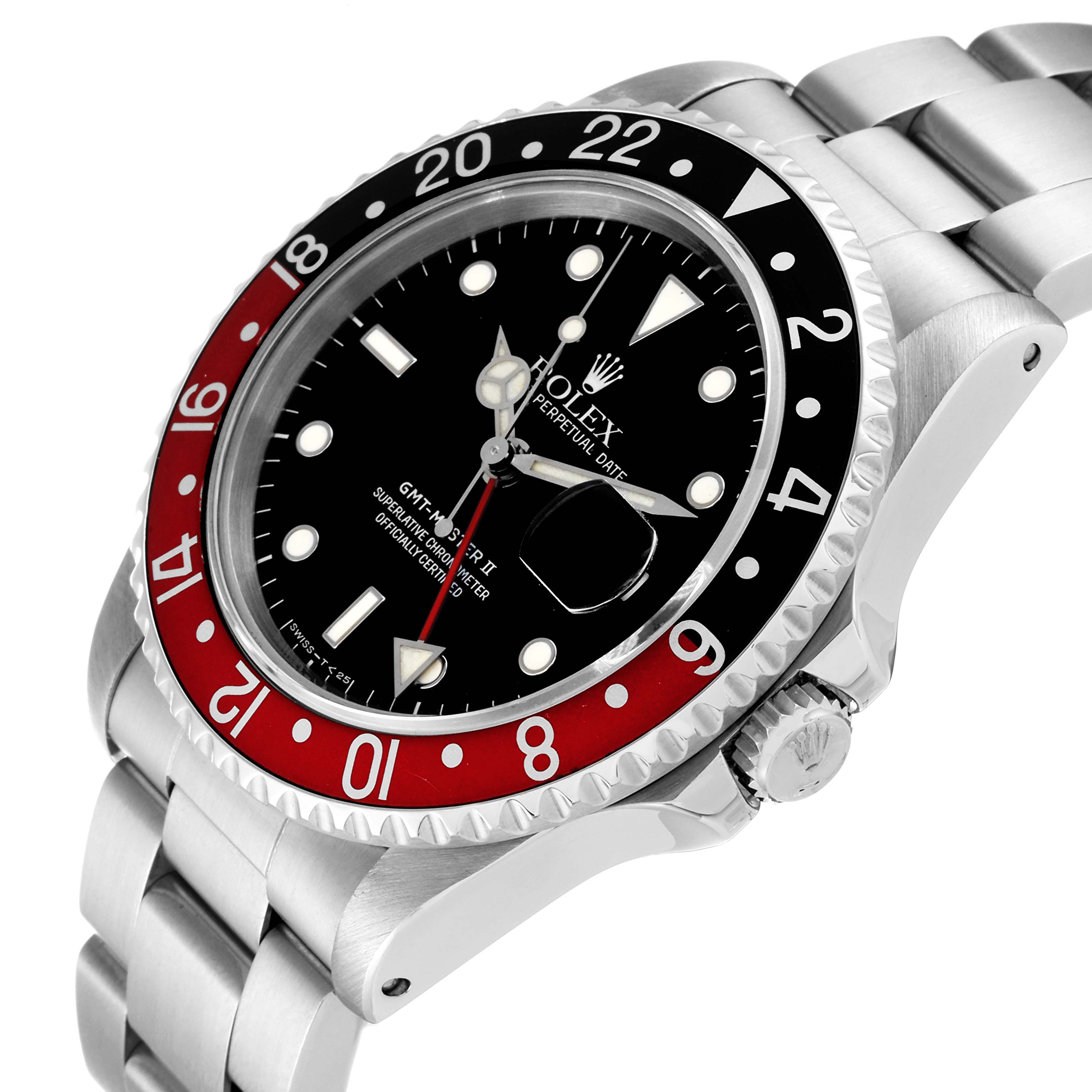 The image shows a close-up of the Rolex GMT-Master 16710 Men
s Stainless Steel Black Dial 16710 Men
s Stainless Steel Black Dial II watch, highlighting its red and black bezel, dial, and part of the bracelet.