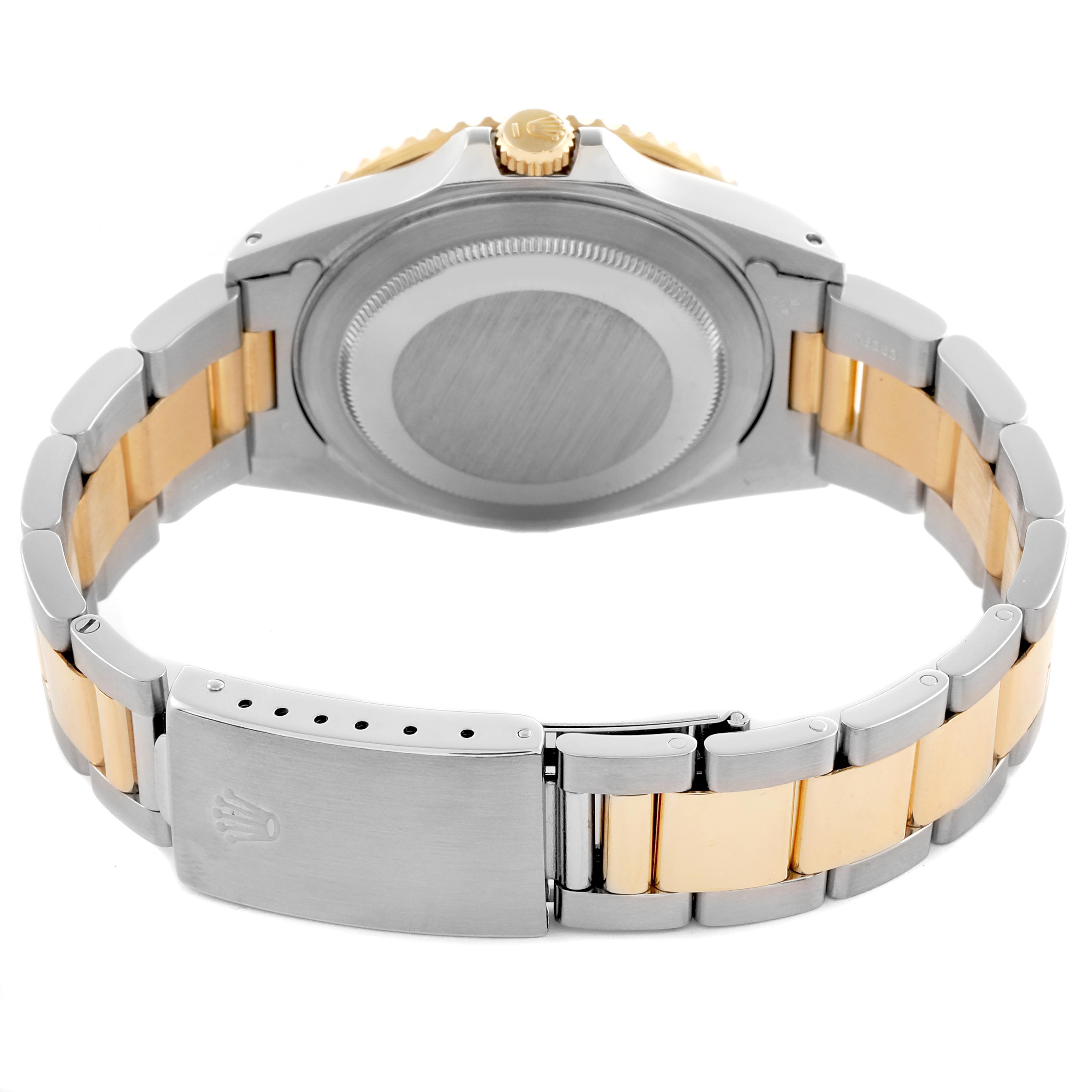 The image shows the back case and bracelet of a Rolex GMT-Master 16713 Men's Steel and Gold (two tone) Brown Dial 16713 Men's Steel and Gold (two tone) Brown Dial watch at a rear angle.