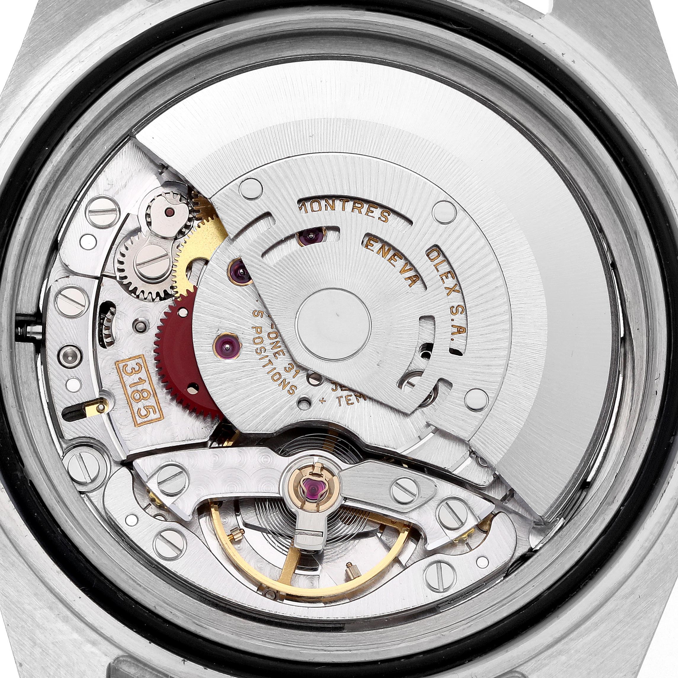 The image shows the movement of a Rolex GMT-Master 16713 Men's Steel and Gold (two tone) Brown Dial 16713 Men's Steel and Gold (two tone) Brown Dial watch from the back, highlighting gears and the rotor.