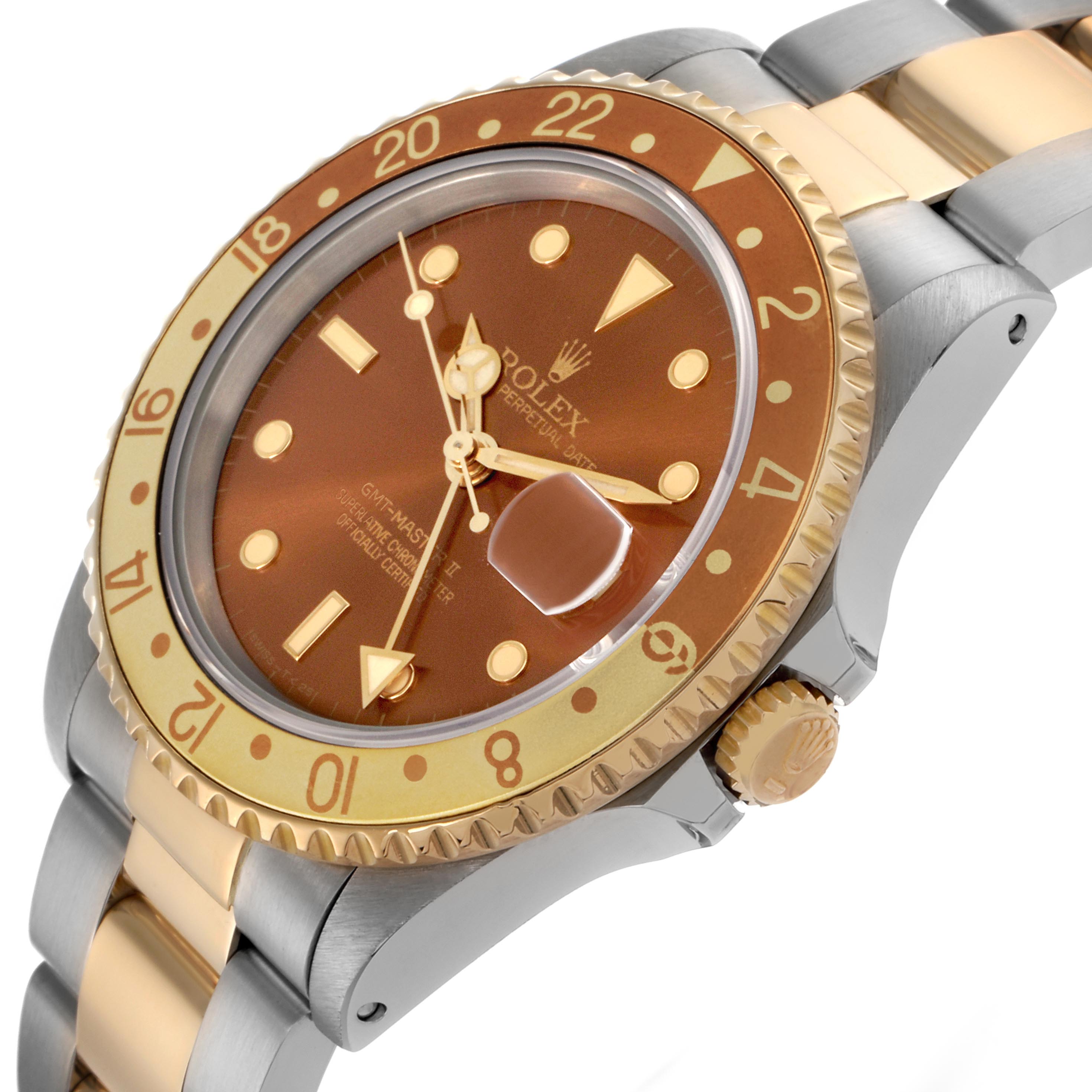 The Rolex GMT-Master 16713 Men's Steel and Gold (two tone) Brown Dial 16713 Men's Steel and Gold (two tone) Brown Dial is shown at an angle highlighting the bezel, dial, crown, and part of the bracelet.