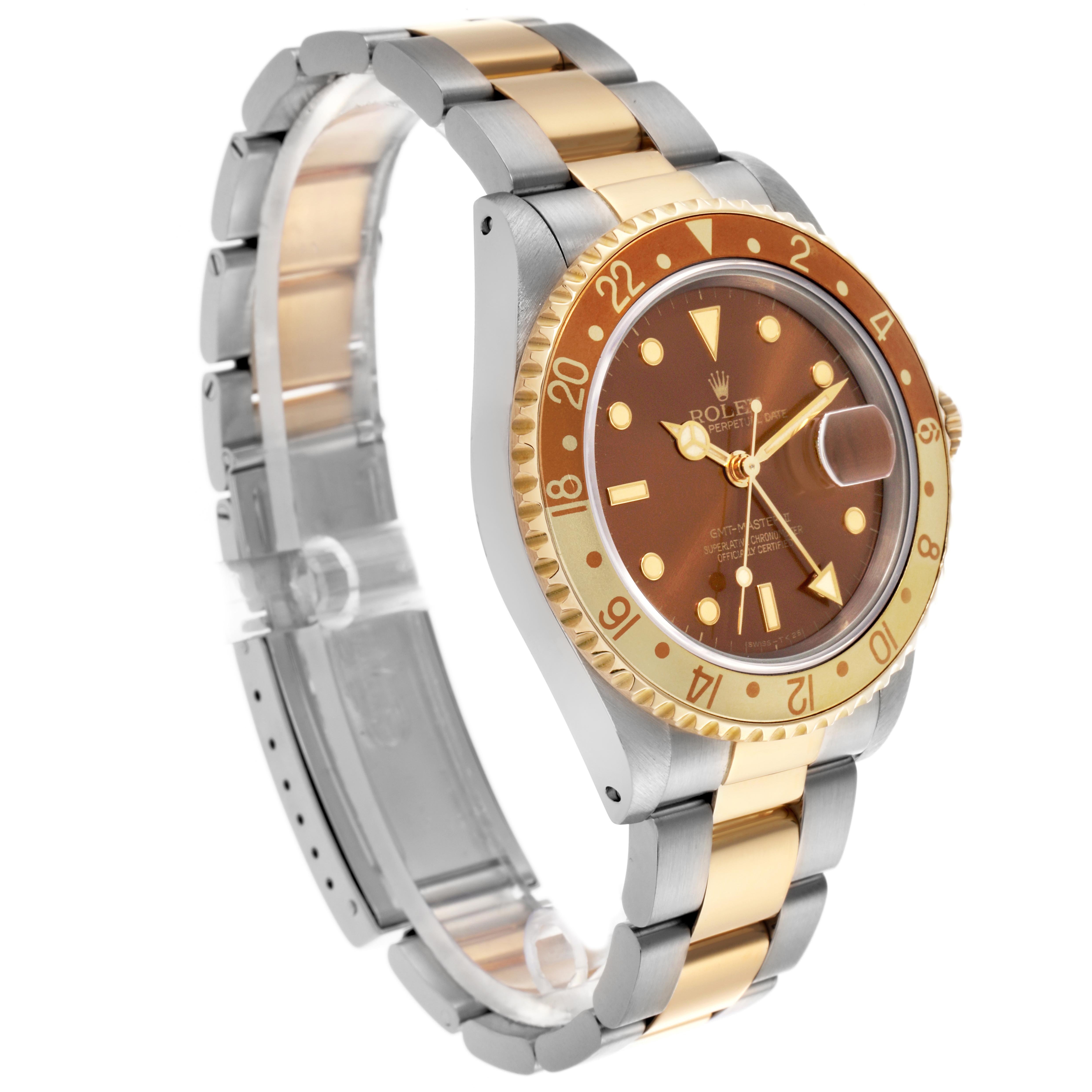 The Rolex GMT-Master 16713 Men's Steel and Gold (two tone) Brown Dial 16713 Men's Steel and Gold (two tone) Brown Dial is shown at a three-quarter angle, highlighting the bezel, dial, and part of the bracelet.