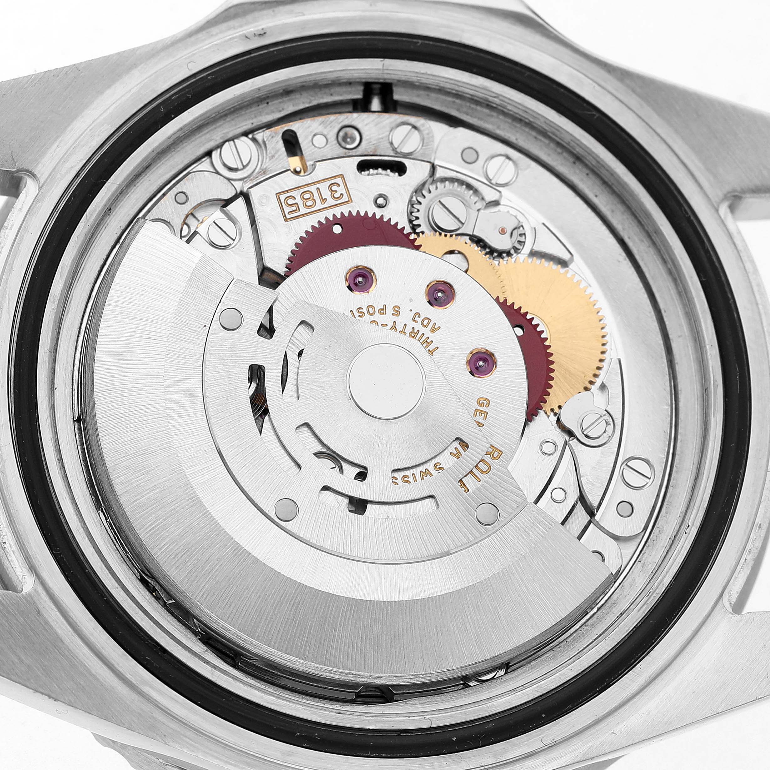 The image shows the movement of a Rolex GMT-Master 16710 Men's Stainless Steel Black Dial, including gears and components, viewed from the back with the case back removed.