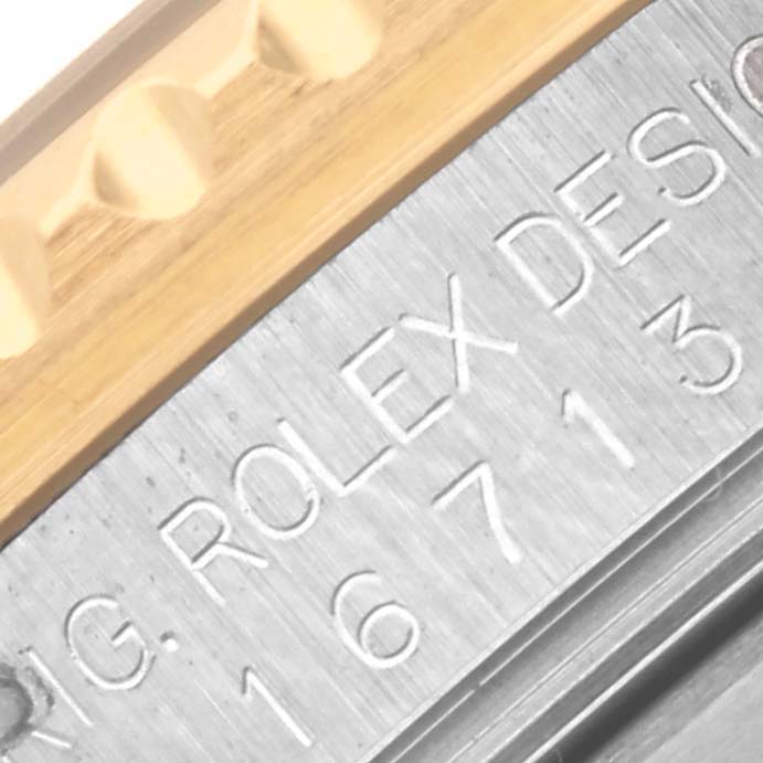 The image shows a close-up of the engraved case side of a Rolex GMT-Master 16713LN Men's Steel and Gold (two tone) Black Dial 16713LN Men's Steel and Gold (two tone) Black Dial, highlighting the model number.