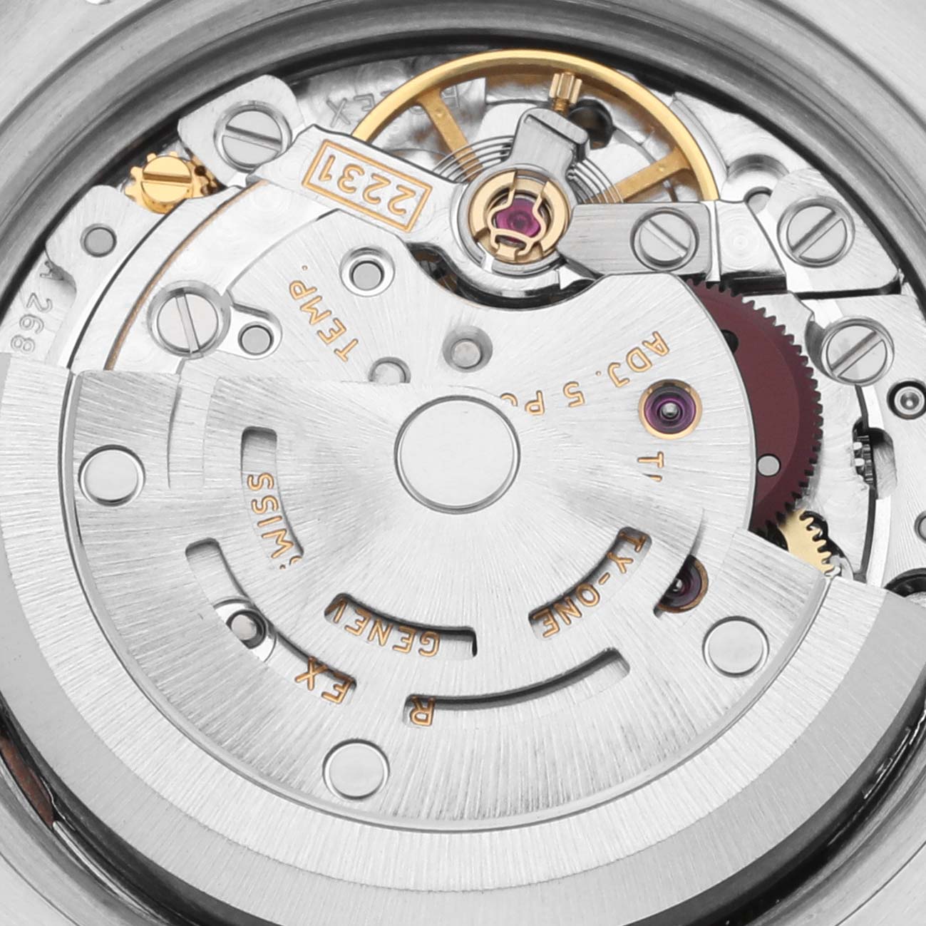 The image shows a close-up of the movement of a Rolex Oyster Perpetual 176210 Women's Stainless Steel Pink Dial 176210 Women's Stainless Steel Pink Dial watch, highlighting the rotor and gears.
