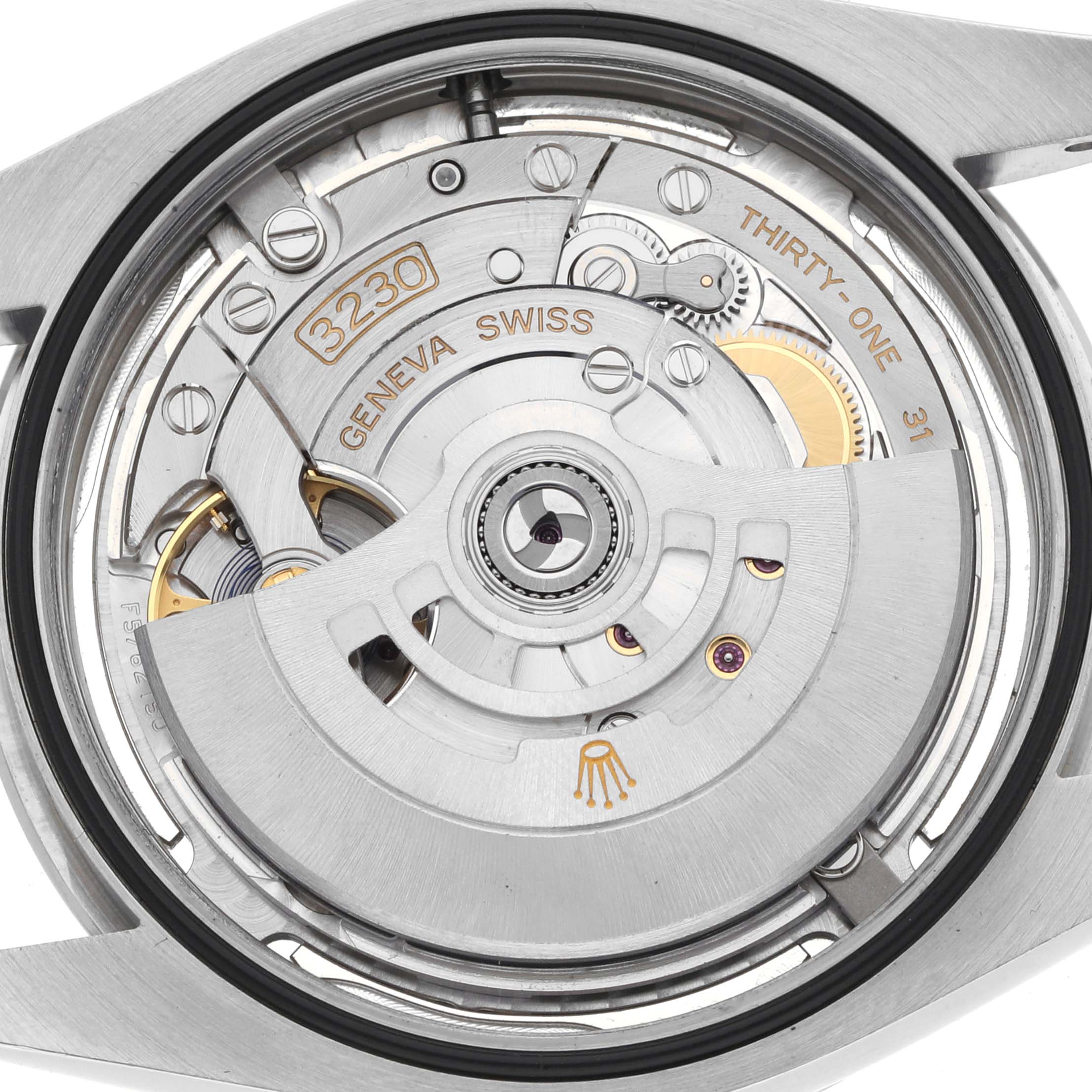 The image shows the movement of a Rolex Oyster Perpetual 124300 Men's Stainless Steel Silver Dial 124300 Men's Stainless Steel Silver Dial watch from a back angle, highlighting the rotor and internal components.