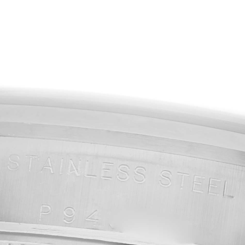 The image shows the inner side of a stainless steel ring, likely part of a Rolex Mid-Size 77080 Women's Stainless Steel Silver Dial 77080 Women's Stainless Steel Silver Dial watch case.