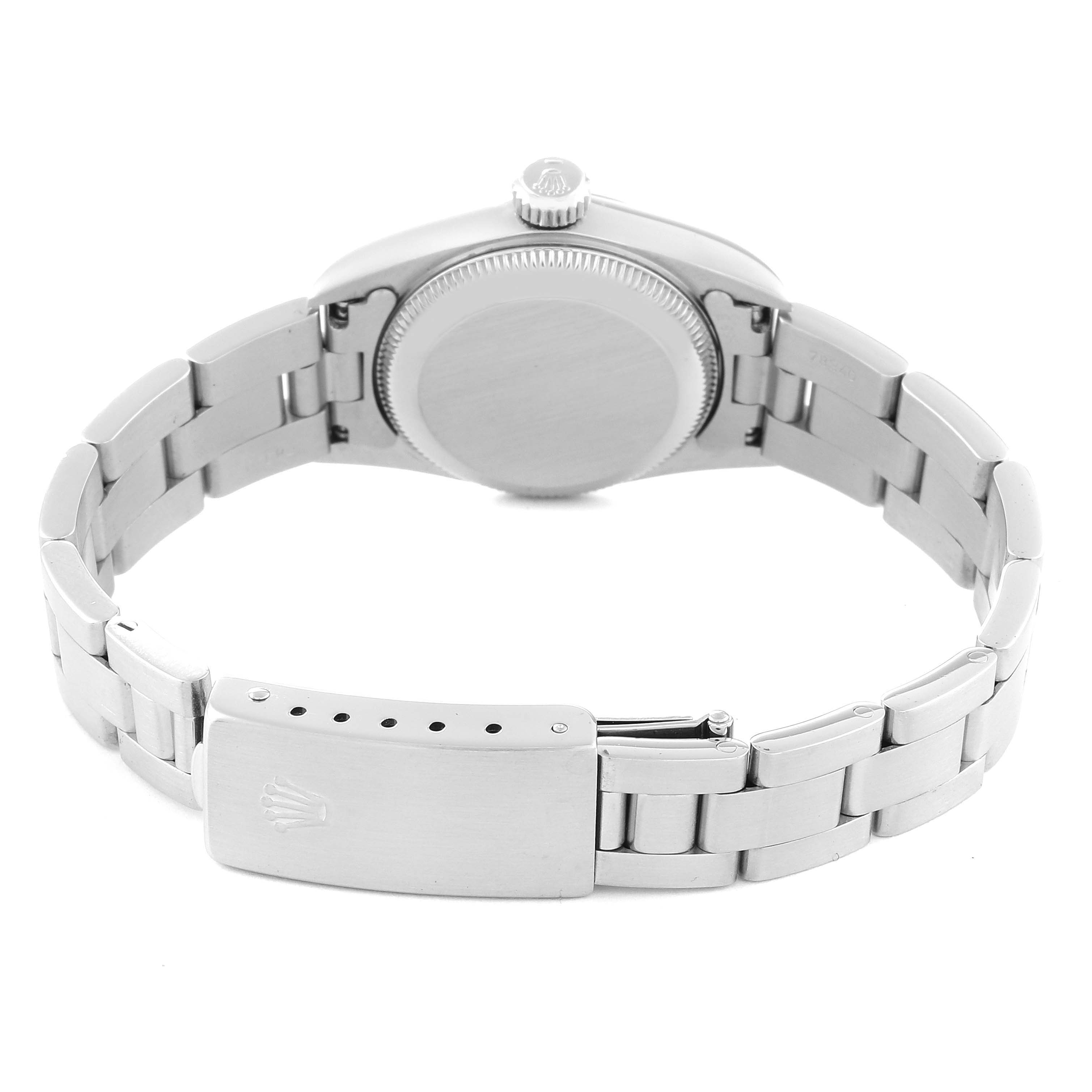 The image shows the rear view of a Rolex Oyster Perpetual 67180 Women's Stainless Steel Pink Dial 67180 Women's Stainless Steel Pink Dial watch, displaying the case back and bracelet clasp.