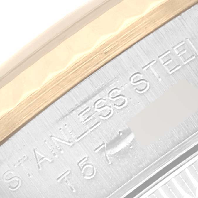 This image displays a close-up of the stainless steel engraving on the casing of a Rolex Oyster Perpetual 67193 Women's Steel and Gold (two tone) Black Dial 67193 Women's Steel and Gold (two tone) Black Dial watch.