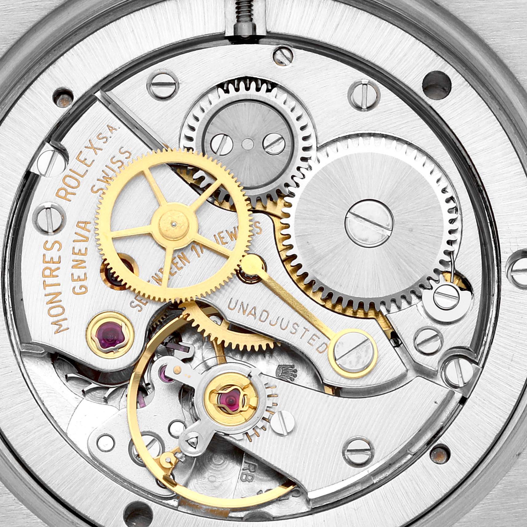 The image shows a detailed view of the Rolex Vintage Collection 6694 Men's Stainless Steel Silver Dial 6694 Men's Stainless Steel Silver Dial watch's inner mechanical movement with gears and jewels.