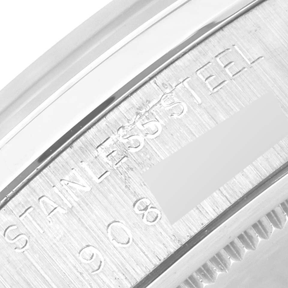 The image shows a close-up of the stainless steel back of a Vintage Collection model by Rolex.