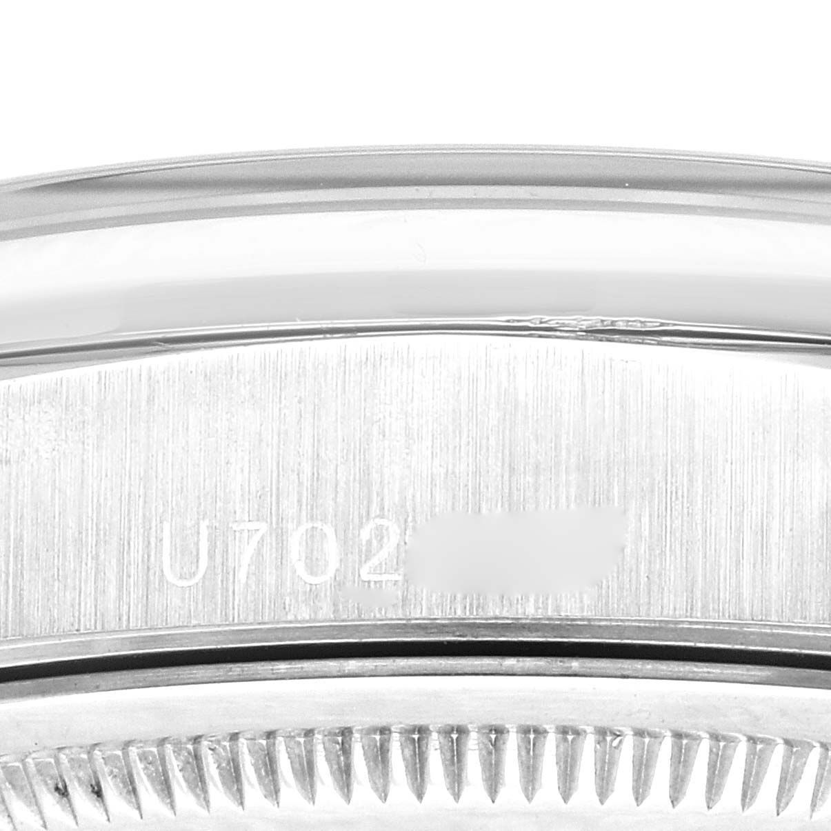 The image shows a close-up of the case back and serial number engraving on a Rolex President 18206 Men's Platinum Blue Dial 18206 Men's Platinum Blue Dial watch.