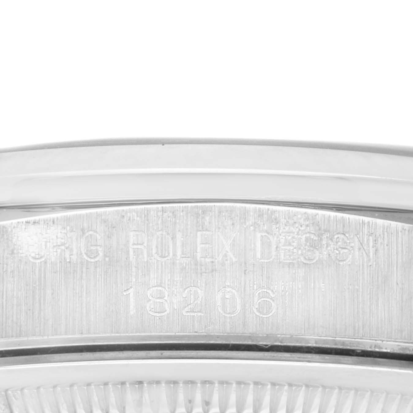 This is a close-up angle of the case back and outer edge of a Rolex President 18206 Men's Platinum Blue Dial 18206 Men's Platinum Blue Dial model, showing the engraved model number 18206 and "ORIG ROLEX DESIGN."