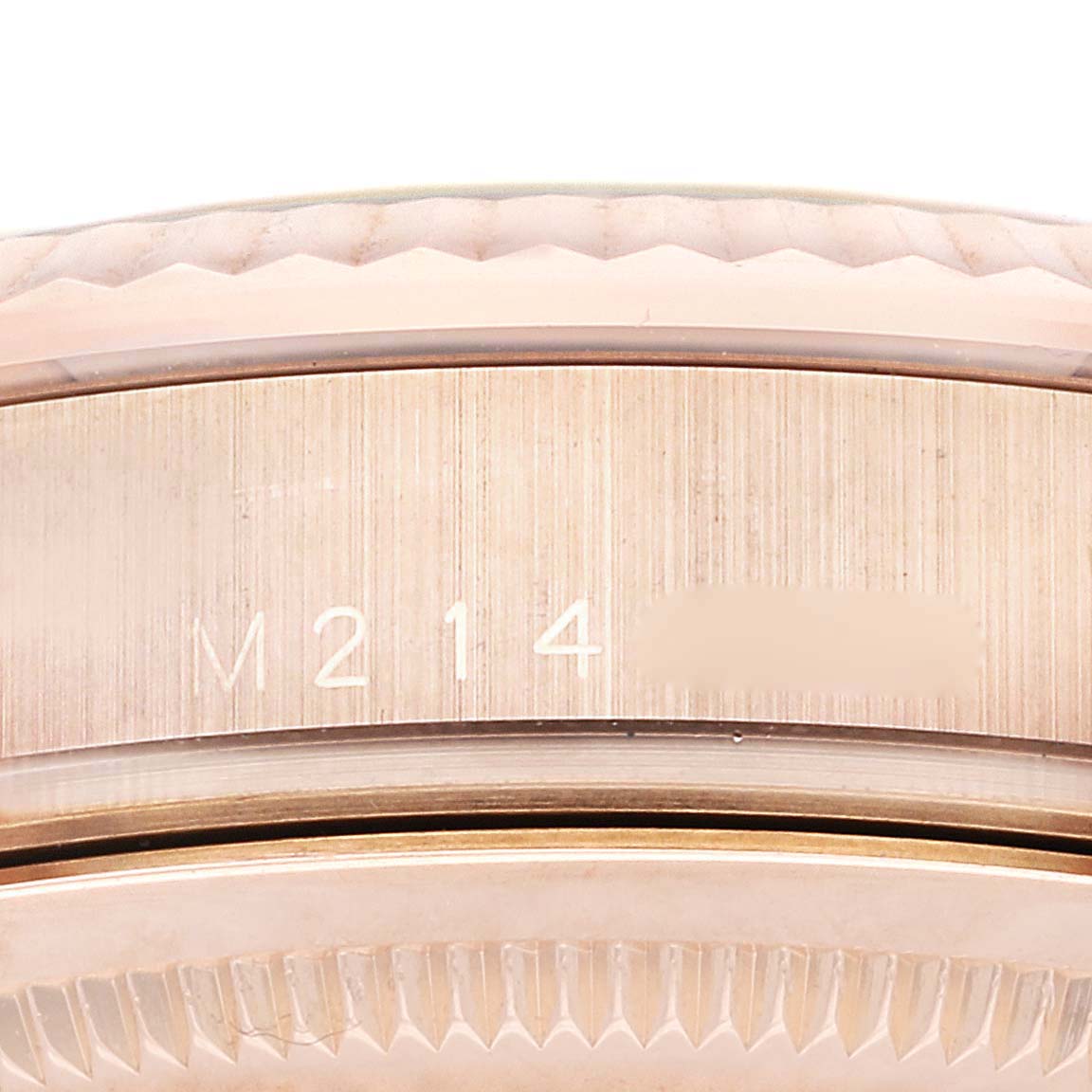 This close-up image shows the case side with model engraving of a Rolex President 118235 Men's Rose Gold Silver Dial 118235 Men's Rose Gold Silver Dial watch.