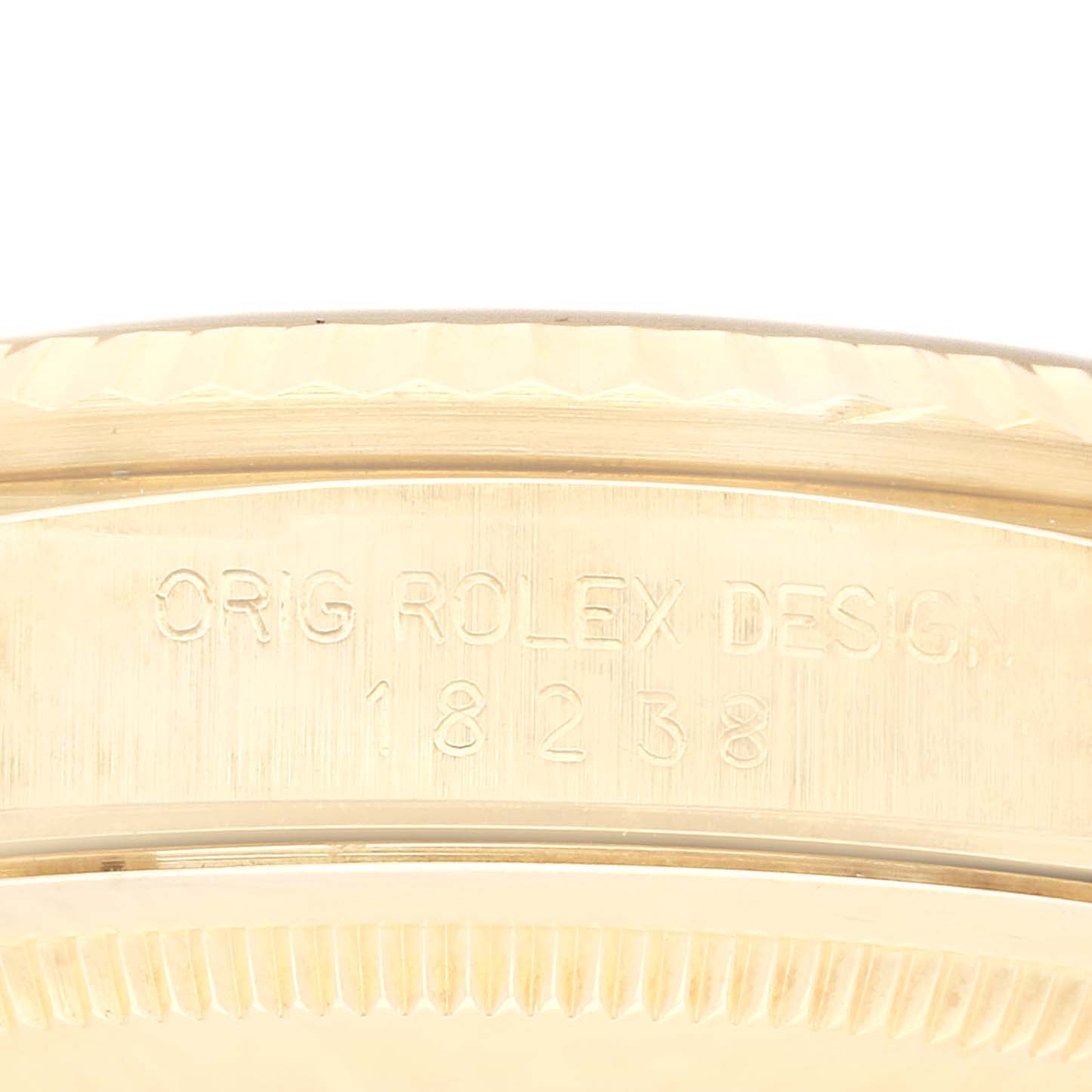 The close-up image shows the side view of the Rolex President 18238 Men
s Yellow Gold Champagne Dial 18238 Men
s Yellow Gold Champagne Dial model
s case, highlighting the engraved model number.